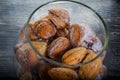 closeup handmade baked nuts with boiled condensed milk in glass jar