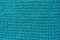 Closeup of handmade turquoise knitwork from above