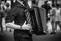 Hands of accordionist playing accordion in the street