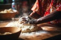 closeup of the hands of a african american person making dough on table