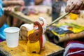 students learning paint on wood animal doll in the art classroom