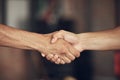 Closeup on hands of athletes handshake in the gym. Two bodybuilders greeting before workout together. hands of fit men