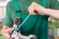 Closeup of the hands of bicycle mechanic at work Royalty Free Stock Photo