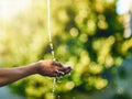 Closeup of hands catching fresh water outdoors, having fun in nature and practicing good hygiene. Person washing their