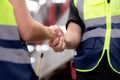 Closeup hands caucasian engineer man and woman meeting and checking electric train for planning maintenance and handshake.