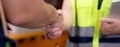 Closeup hands caucasian engineer man and woman meeting and checking electric train for planning maintenance and handshake.