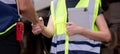 Closeup hands caucasian engineer man and woman meeting and checking electric train for planning maintenance.