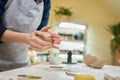 Closeup hands of ceramic artist wedging clay in art studio Royalty Free Stock Photo