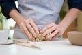 Closeup hands of ceramic artist wedging clay in art studio Royalty Free Stock Photo