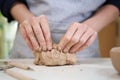 Closeup hands of ceramic artist wedging clay in art studio Royalty Free Stock Photo