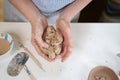 Closeup hands of ceramic artist wedging clay in art studio Royalty Free Stock Photo