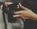 Closeup of hands checking film in camera Royalty Free Stock Photo