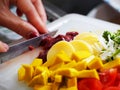 Closeup of hands of chef cook cutting