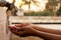 Closeup of hands, child drinking water directly from corporation tap water in India Royalty Free Stock Photo