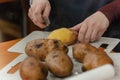 Closeup of hands cleaning potatoes