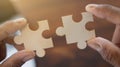 Closeup of hands connecting jigsaws find best business solution or option. Businessman connect pieces of puzzle think of problem