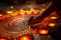 Closeup of hands creating intricate rangoli