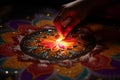 Closeup of hands creating intricate rangoli