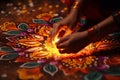 Closeup of hands creating intricate rangoli