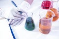 Closeup of hands of Female Laboratory Worker Dealing With Flasks Royalty Free Stock Photo