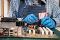 Closeup hands of female technician measuring electrical voltage of computer mainboard by using multimeter. Maintenance Royalty Free Stock Photo