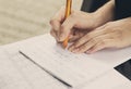 Closeup of hands of girl studying for universitet exam.