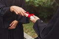 Closeup of hands giving graduation certificate Royalty Free Stock Photo