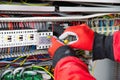 Closeup of hands in gloves doing electrical installation work. Royalty Free Stock Photo