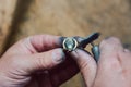 Closeup on hands of goldsmith working on a ring in his workshop Royalty Free Stock Photo