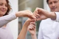 Closeup hands of happy married couple holding up house keys. Man and woman holding keys to new house or apartment. Young Royalty Free Stock Photo