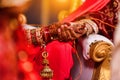 Closeup of hands with henna tattoos during an Indian traditional wedding ceremony, kanyadan ritual Royalty Free Stock Photo