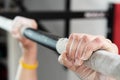 Closeup of hands holding a pull-ups bar