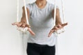 Closeup hands holding the rope, iyengar yoga at studio