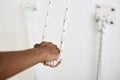 Closeup hands holding the rope, iyengar yoga at studio