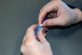 Closeup of hands of information technology techie working with cabling