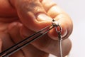 Closeup hands of jeweler at work in jewelry. Desktop for craft jewelry making with professional tools. Royalty Free Stock Photo