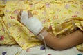 Closeup of hands of a little Boy attaching intravenous tube to p Royalty Free Stock Photo