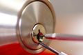 Closeup hands of locksmith using metal pick tools to open locked door