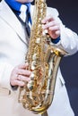 Closeup of Hands of Male Saxophone Player Posing With Sax