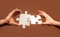 Closeup hands of man connecting jigsaw puzzle. Business solutions, success and strategy concept. Two hands trying to Royalty Free Stock Photo