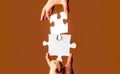 Closeup hands of man connecting jigsaw puzzle. Business solutions, success and strategy concept. Two hands trying to Royalty Free Stock Photo