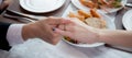 Closeup hands of man putting ring on finger of woman for marriage or engagement together with surprise.