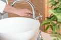 Closeup hands of man is washing hands under running water. bathroom interior Royalty Free Stock Photo