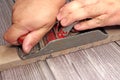 closeup of hands of a man working tool planed carpentry Royalty Free Stock Photo