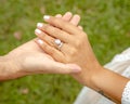 Closeup of the hands of a newlywed couple at a wedding in Australia