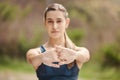 Closeup of hands of one fit young mixed race woman stretching arms for warmup to prevent injury while exercising Royalty Free Stock Photo