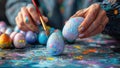 Closeup of hands painting colorful Easter eggs Royalty Free Stock Photo