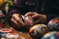 Closeup of hands painting and decorating Easter