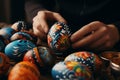 Closeup of hands painting and decorating Easter