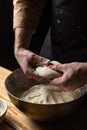 Closeup of the hands of a person kneading a dough with flour for the pizza Royalty Free Stock Photo